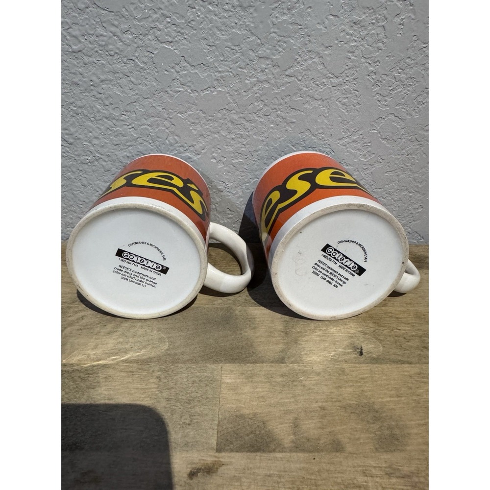 Reese's Set of 2 Galerie Orange Ceramic Coffee Mugs With Yellow Logo - Picture 2 of 2